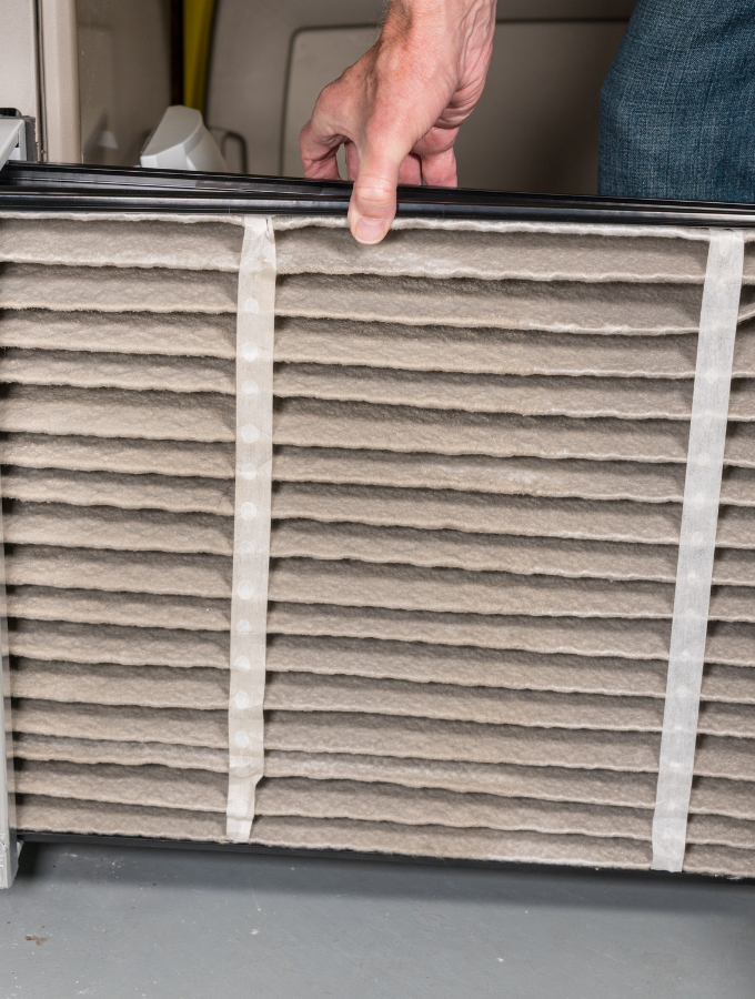 Air For Less technician on a maintenance visit